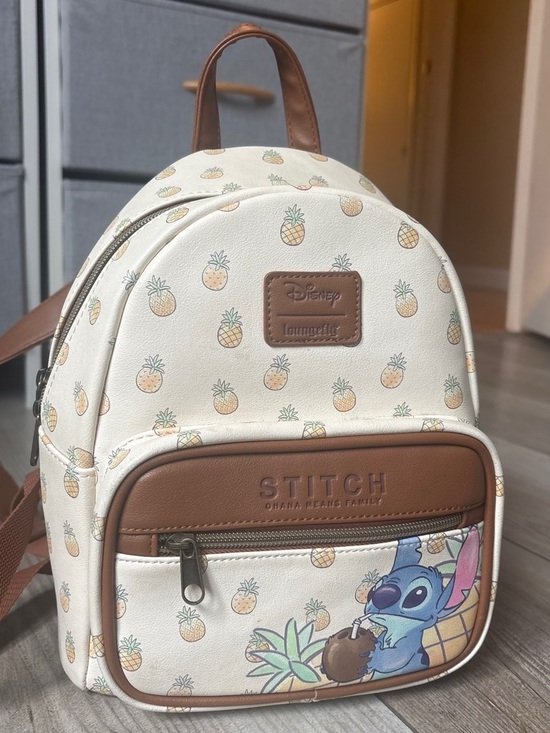 disney pineapple mini backpack EXCLUSIVE DROP: Loungefly Parks Dole Whip Swirl This Lilo and Stitch Pineapple Backpack features one main compartment and one front accessory pocket with zipper closures for organization and securing their belongings Disney Loungefly Pineapple Mini Backpack